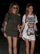 Paris Jackson and DJ Caroline D'Amore walk hand in hand while attending the Moschino afterparty in Hollywood, CA 08/06/2018