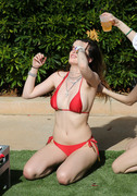 Bella Thorne - wears a red bikini and has her sister Dani wash her hair with a beer by the pool in Miami 03/13/2019