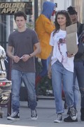Zendaya and Tom Holland - pose with a Spiderman statue at a comic store in LA, CA 03/29/2018