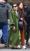 Zoe Kravitz - in a long green coat and pinstripe pantsuit during NYFW 02/12/2020