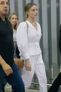 Margot Robbie - is surrounded by her security guards as she arrives in Sao Paulo 12/07/2019
