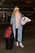 Elle Fanning - rocks a big and colorful Gucci bag as she arrives at LAX airport in LA 02/29/2020